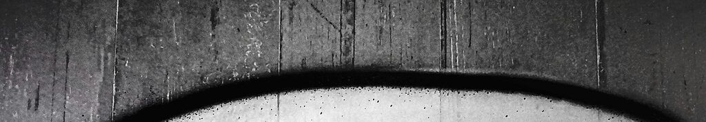 Black and white street art featuring a bold motivational message in a speech bubble.